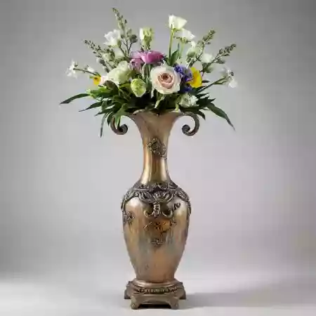 Master artisan engraving initials on vase